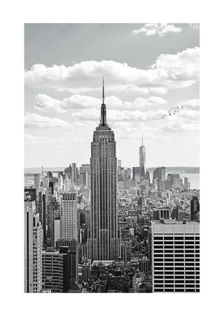 Black and white poster of the Empire State Building towering over the New York City skyline.