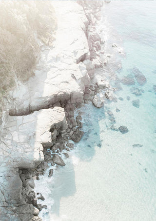 Aerial view of a rocky beach with turquoise water featured on the Rocky Beach Plakat product page.