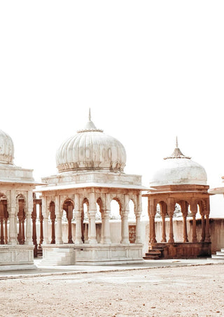 Poster of ancient marketplace with ornate stone pavilions and domes under a bright, clear sky.