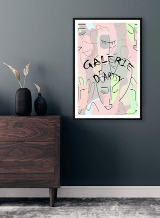 Framed Eyes Wide Shut artwork by Vincent von Hauzer on a grey wall above a wooden dresser with vases.
