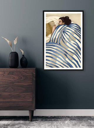 Framed print of The Good Book by Martina Karlsson above a dresser against a dark gray wall.