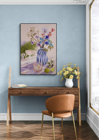 Lilac Summer - Goed Blauw artwork hanging above a wooden desk in a stylish, modern room with blue walls.