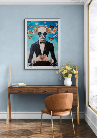 Framed "My Butterfly - Martin Zen" art print hangs above a wooden desk with flowers in a modern room.