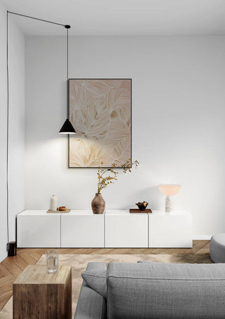 Dance of Existence artwork hanging above a modern white cabinet in a minimalist living room setting.