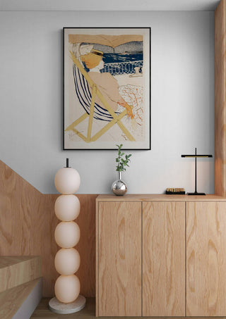 La PassagAure Du 54 - Lautrec art print displayed above a modern wooden cabinet in a minimalist room.