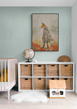 Framed "Fox In a Poncho" artwork displayed above woven storage baskets in a children's room.