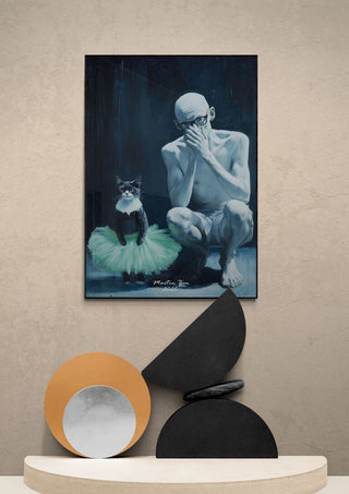 Poster of "Teach The Cat - Martin Zen" showing a man and a cat in a tutu, displayed above modern decor.