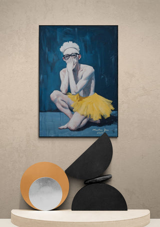 A framed "Magic Ballet - Martin Zen" artwork featuring a person in a yellow tutu, displayed above modern decor.