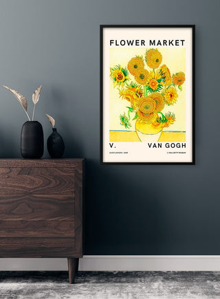 Framed Van Gogh Flower Market No. 2 Plakat with bright sunflowers on a yellow background hanging on a wall.