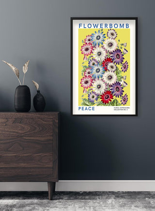 Framed Flowerbomb - Peace Plakat featuring colorful flowers on a yellow background, hung above a wooden dresser.