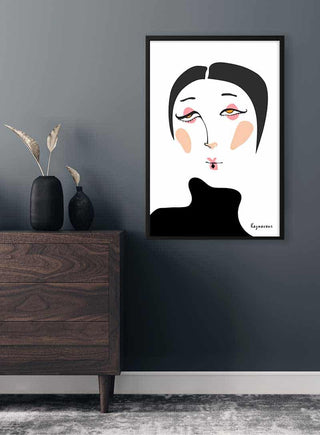 Poster of a surrealistic female portrait by Kaznavour on a dark wall above a wooden dresser with minimalist decor.