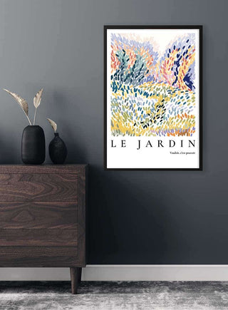 Le Jardin - Vouloir, c'est pouvoir Plakat poster with abstract colorful brushstrokes in a modern room setting.