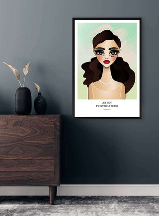 Framed Green Provocateur - Vincent V. art print of a stylized woman displayed on a dark wall above a wooden dresser.