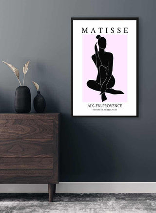 Framed Matisse inspired pink and black plakat featuring a minimalist silhouette on a modern wall.