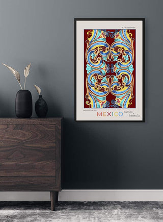 Framed Mexico City Art Basel poster with colorful ornate design, displayed above a dark wooden dresser.