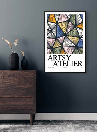 Framed Artsy Harlequin - Vincent von Hauzer poster with colorful geometric design on modern dark wall.