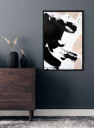 Abstract painting "Black and Nude No 3" by Anastasia Sawall in black frame on a gray wall above a wooden dresser.