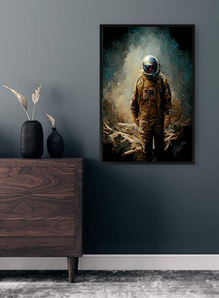 Framed artwork of an astronaut standing alone, displayed above a wooden chest on a dark wall.