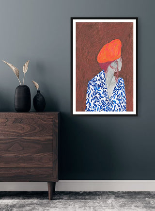 Framed print of "Phrygian Cap" by Martina Karlsson displayed above a modern wooden dresser.