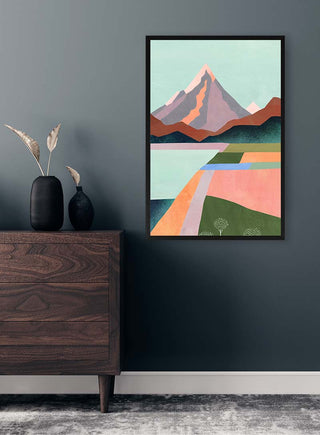 First Blossom by Henry Rivers framed on a dark wall above a wooden dresser with vases and dried plants.