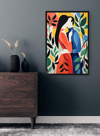 Framed The Kiss No 03 by David Wolf on a dark wall above a wooden dresser with decorative vases.