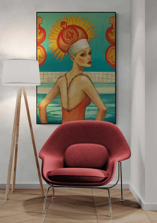 Framed Swimmingpool artwork by Martina Karlsson displayed above a modern chair and floor lamp in a living room.