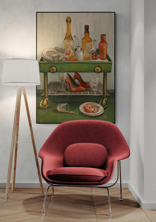 Artwork "Afterparty" by Martina Karlsson displayed behind a red chair and floor lamp in a modern interior.
