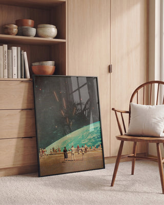 Framed "The Others" by Frank Moth leaning against a cabinet in a cozy, modern room with wooden decor.