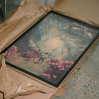 Framed "There Will Be Light In the End" by Frank Moth, two figures in a surreal floral landscape.