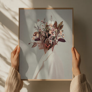 Hands holding a framed print of "I Fell In Love With Fall Because of You" by Frank Moth, featuring floral collage art.