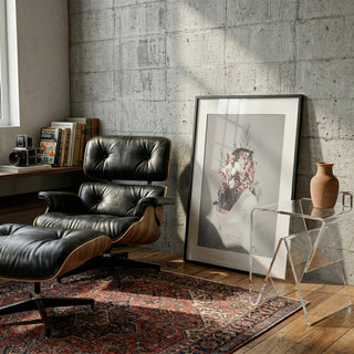 Framed "You Gifted Me an Autumn" print by Frank Moth in a modern living room with lounge chair and rug.