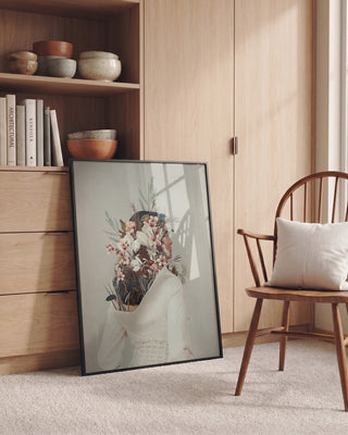 Framed "You Gifted Me an Autumn" by Frank Moth leaning against a dresser in a cozy, modern room.