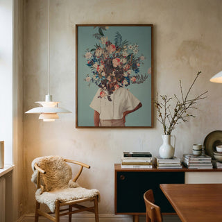 Framed "Thank God It's Spring" art by Frank Moth featuring a floral bouquet on a figure's head in a cozy room.