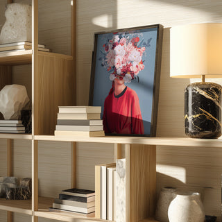 Framed "We Gathered In Spring" by Frank Moth displayed on a modern wooden shelf with books and decor.