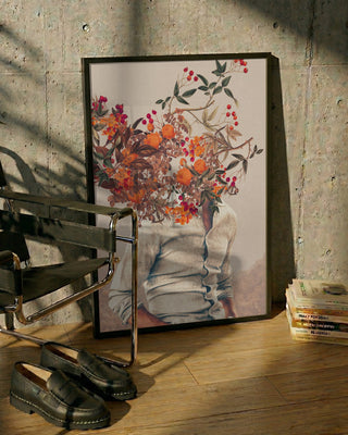 Framed Roots Bright art by Frank Moth showing a person with vibrant floral bouquet as their head, leaning on a wall.
