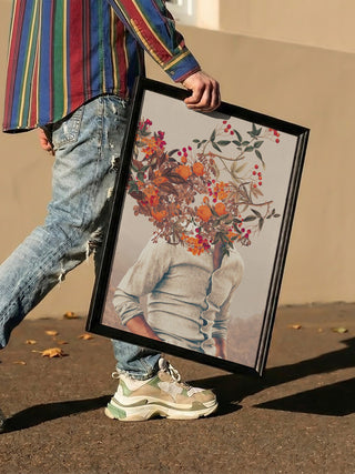 Person holding framed Roots Bright - Frank Moth art print featuring a floral surreal portrait.