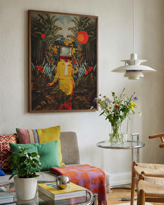 Framed "She Came From the Wilderness" by Frank Moth hanging above a colorful, modern living room setup.