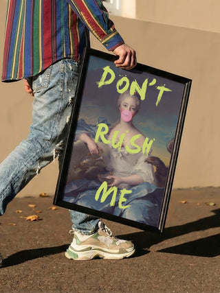 Person holding framed "Don't Rush Me" portrait by Talitha McQueen featuring a classical painting with bubblegum.