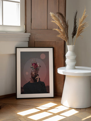 Framed "Pale Memories of Dusk" artwork by Frank Moth leaning against a wall in a sunlit room.