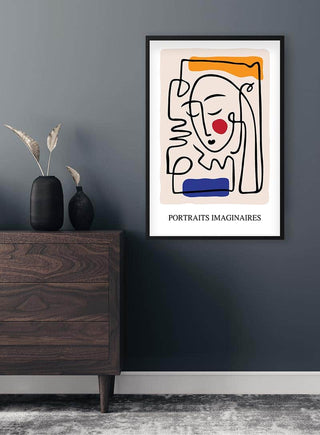 Picasso inspired abstract line art portrait poster with colorful accents, framed and hung on a modern wall.