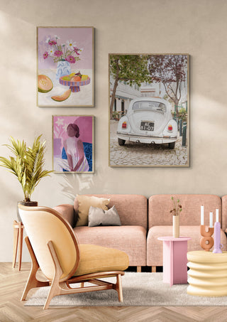 Framed photo of a vintage white car parked in Cascais, displayed on a stylish living room wall.