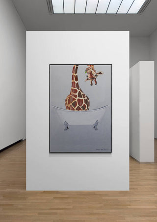 Art print of a giraffe sitting in a bathtub, displayed on a white wall in a modern gallery setting.