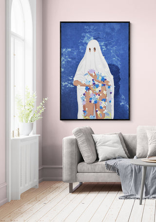 "Ghost" by Raissa Oltmanns framed on a pink wall above a light gray sofa in a modern living room.