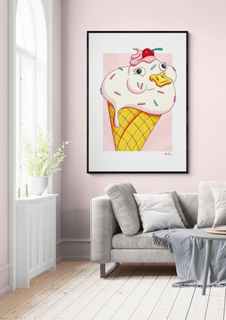 Framed Waffle Duck - Nanna Paavig artwork featuring a duck in an ice cream cone, displayed above a sofa.