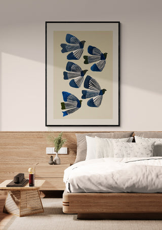 Framed "Birds in Flight" by Branka Kodžoman displayed above a modern bed in a minimalist bedroom.