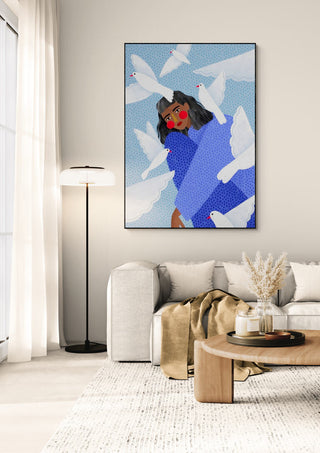 Framed "Birds - Bea Muller" artwork featuring a woman and white birds, displayed in a modern living room.