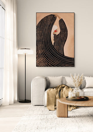 Framed "The Woman With the Black Dress" by Bea Muller displayed above a modern beige sofa in a bright living room.