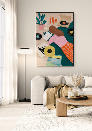 Framed "Record Playing - Bea Muller" artwork displayed in a modern living room above a beige sofa.