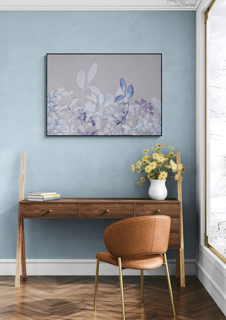 Watercolor Pastel Garden Blue artwork above a wooden desk in a modern, light blue room with flowers.