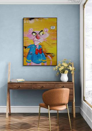 Pink Duck by Daniel Leo artwork on a blue wall above a wooden desk, with a chair and vase of flowers.